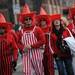 Nebraska fans show their team pride with stripes and cowboy hats as they walk outside Memorial Stadium in Lincoln, Nebraska on Saturday. Melanie Maxwell I AnnArbor.com